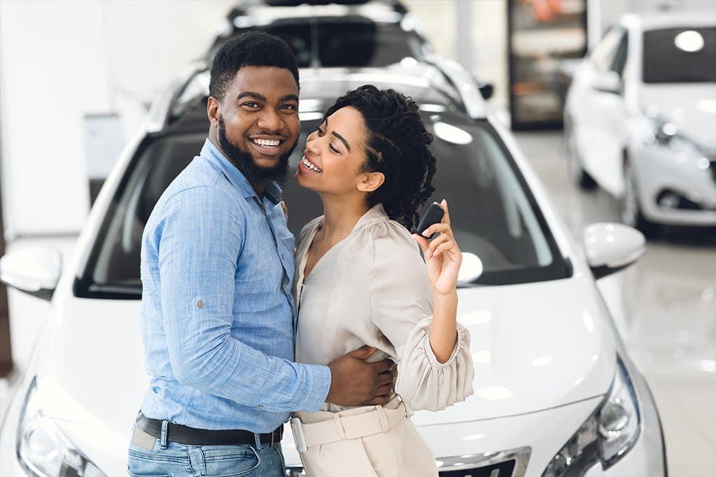 happy-couple-buying-car
