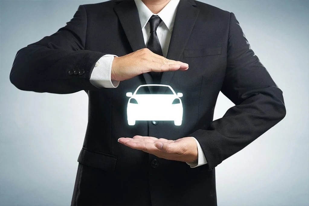 Illustration of a car protected between two hands